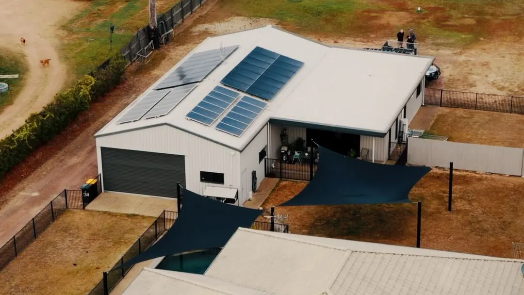 Aerial view of the Alice River home and shed with solar panels on the roof